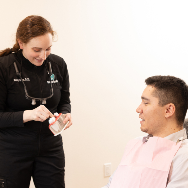 Dr. Keely Goter demonstrating a jaw model to a patient